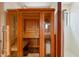 This wooden sauna is located in the primary bathroom next to the glass enclosed shower at 511 W Cherrywood Dr, Sun Lakes, AZ 85248