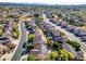 Suburban community with an aerial view of many homes, streets, and neighborhood landscaping at 5291 W Angela Dr, Glendale, AZ 85308