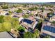 Lovely aerial view of a home and neighborhood featuring a manicured backyard and solar panels at 5291 W Angela Dr, Glendale, AZ 85308