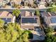 Stunning aerial view of home featuring solar panels, an outdoor patio and landscaped backyard at 5291 W Angela Dr, Glendale, AZ 85308