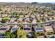 Wonderful aerial view of a neighborhood with many homes featuring desert landscaping and solar panels at 5291 W Angela Dr, Glendale, AZ 85308