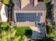 Home aerial view featuring a backyard patio, fire pit, garden and efficient solar panels at 5291 W Angela Dr, Glendale, AZ 85308