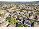 A beautiful aerial view shows the layout of this neighborhood and many homes feature solar panels and/or backyard pools at 5291 W Angela Dr, Glendale, AZ 85308