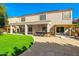 Outdoor living area features a built-in bar, lush lawn, and covered patio, perfect for entertaining and relaxing at 5291 W Angela Dr, Glendale, AZ 85308