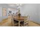 Inviting dining room with a round table, seating six, and a view into the spacious living area at 5291 W Angela Dr, Glendale, AZ 85308