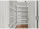 Bright pantry with plenty of shelving for storage at 5291 W Angela Dr, Glendale, AZ 85308