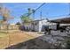 Backyard featuring a storage shed, patio, and drought resistant plants at 5517 N 61St Ln, Glendale, AZ 85301