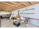 Covered space featuring two chairs and a table with shelving at 5517 N 61St Ln, Glendale, AZ 85301