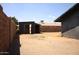 Wide backyard featuring brick fence, shed, and potential for outdoor activities with space for landscaping at 6319 E Albany St, Mesa, AZ 85205