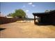 Backyard with an in-ground pool, patio area, and mature trees, perfect for outdoor relaxation at 6319 E Albany St, Mesa, AZ 85205