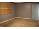 Bedroom with a boarded-up window and blue walls at 6319 E Albany St, Mesa, AZ 85205