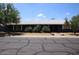 Charming single-story home featuring a well-maintained front yard and a freshly painted dark blue exterior at 6319 E Albany St, Mesa, AZ 85205