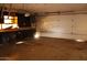 Spacious garage featuring a work area with workbench and storage cabinets, ready for customization at 6319 E Albany St, Mesa, AZ 85205