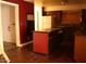 Kitchen with an island, dark cabinets, and a white refrigerator at 6319 E Albany St, Mesa, AZ 85205