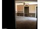 View of a carpeted living room, showcasing spacious layout at 6319 E Albany St, Mesa, AZ 85205