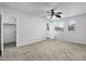 Neutral bedroom with a ceiling fan, carpeted floors, closet, and windows at 7650 E Williams Dr # 1038, Scottsdale, AZ 85255