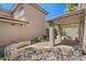 The covered patio area with stone flooring connects seamlessly to the outdoors at 7650 E Williams Dr # 1038, Scottsdale, AZ 85255