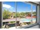 Wonderful view of a community pool and landscaped common areas from a window at 7650 E Williams Dr # 1038, Scottsdale, AZ 85255