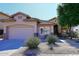 Front exterior showcasing desert landscaping and a neutral color scheme at 7741 E Journey Ln, Scottsdale, AZ 85255