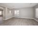 Open living room features wood-look tile and natural lighting at 7741 E Journey Ln, Scottsdale, AZ 85255