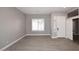 Bright living room featuring wood-look tile floors and plantation shutters at 7741 E Journey Ln, Scottsdale, AZ 85255