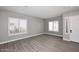 Spacious living room with plantation shutters and wood-look tile floors at 7741 E Journey Ln, Scottsdale, AZ 85255