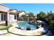 Beautiful pool and spa with rock waterfall and lush landscaping and design at 7741 E Journey Ln, Scottsdale, AZ 85255