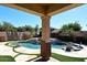 Backyard oasis with beautiful pool and waterfall features and well-manicured landscaping at 7741 E Journey Ln, Scottsdale, AZ 85255