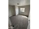 Spacious bedroom with plush carpeting and a window allowing natural light at 8427 W Glendale Ave # 31, Glendale, AZ 85305