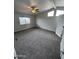 Comfortable carpeted bedroom with ceiling fan and bright windows at 8427 W Glendale Ave # 31, Glendale, AZ 85305