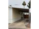 Manufactured home with a covered carport and tidy landscaping at 8427 W Glendale Ave # 31, Glendale, AZ 85305