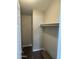 This walk-in closet features a hanging rod and carpeted flooring at 8427 W Glendale Ave # 31, Glendale, AZ 85305