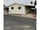 Charming single-story home featuring a covered carport and inviting exterior at 8427 W Glendale Ave # 31, Glendale, AZ 85305