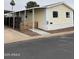 Charming single-story home featuring a covered carport and a cute picket fence at 8427 W Glendale Ave # 31, Glendale, AZ 85305