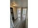 Inviting hallway with hard wood floors leading to a bedroom and kitchen at 8427 W Glendale Ave # 31, Glendale, AZ 85305