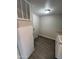 Functional laundry room with modern appliances, ample counter space and luxury vinyl tile flooring at 8427 W Glendale Ave # 31, Glendale, AZ 85305