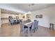 Bright dining area featuring an open floor plan with modern finishes and tile flooring throughout at 8490 S 165Th Dr, Goodyear, AZ 85338