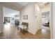 Inviting hallway showcasing wood-look tile flooring and an open view of the kitchen at 8490 S 165Th Dr, Goodyear, AZ 85338