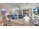 Living room featuring a ceiling fan, sliding door to patio, and view of the backyard at 8490 S 165Th Dr, Goodyear, AZ 85338