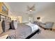 Comfortable main bedroom with ceiling fan, neutral colors, and bright natural light at 8490 S 165Th Dr, Goodyear, AZ 85338