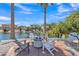 Waterfront backyard featuring a cozy fire pit and comfortable seating area for outdoor enjoyment at 877 E La Costa Pl, Chandler, AZ 85249