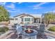 Landscaped backyard featuring a fire pit, seating area and desert plants perfect for outdoor living at 877 E La Costa Pl, Chandler, AZ 85249