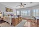 Bedroom features a ceiling fan, hardwood floors, and a neutral color palette at 877 E La Costa Pl, Chandler, AZ 85249