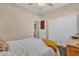 This bedroom features a ceiling fan, hardwood floors, and a closet at 877 E La Costa Pl, Chandler, AZ 85249