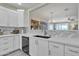 Modern kitchen with stainless steel appliances and white cabinetry at 877 E La Costa Pl, Chandler, AZ 85249