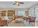 Bright living room features hardwood floors, comfortable seating, and natural light at 877 E La Costa Pl, Chandler, AZ 85249