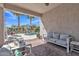 Covered patio with outdoor furniture overlooking sparkling pool and lush landscaping at 877 E La Costa Pl, Chandler, AZ 85249