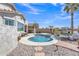 Backyard pool featuring desert landscaping and a relaxing seating area under a clear blue sky at 877 E La Costa Pl, Chandler, AZ 85249