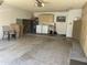 Spacious garage with ample storage cabinets and a laundry area at 9734 W Kerry Ln, Peoria, AZ 85382