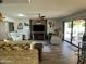 Open concept living room with natural lighting, comfortable seating, and stylish decor at 9734 W Kerry Ln, Peoria, AZ 85382